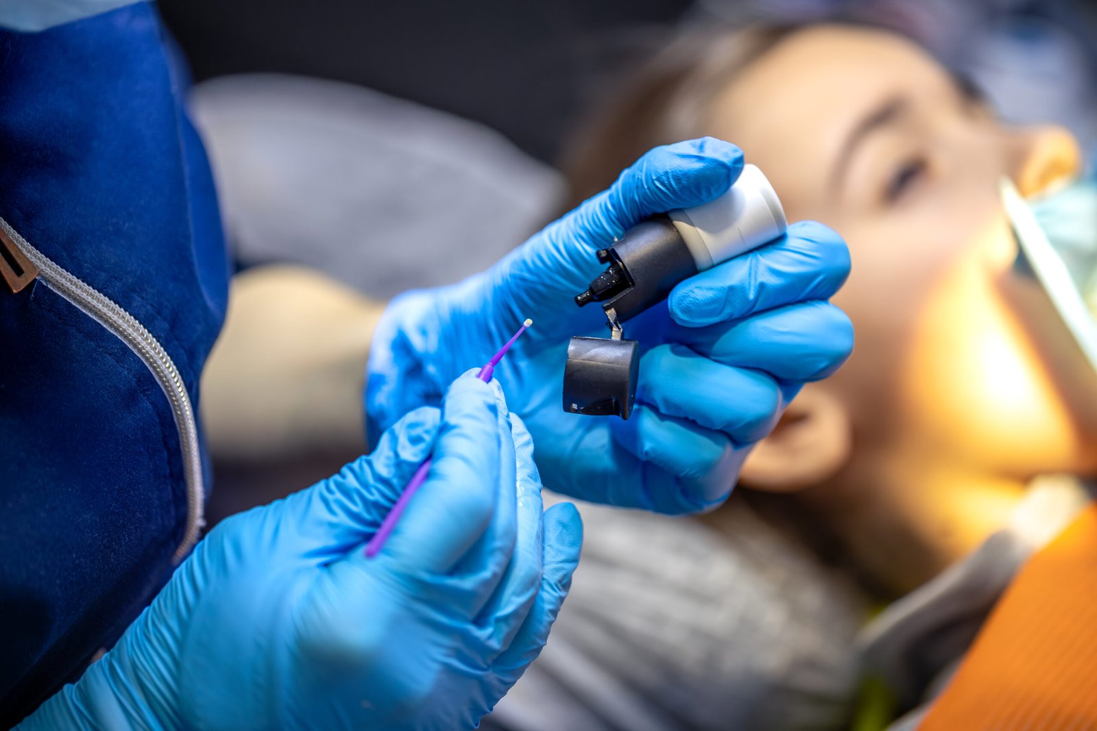Dentist working with material for tooth treatment. Dentistry concept.